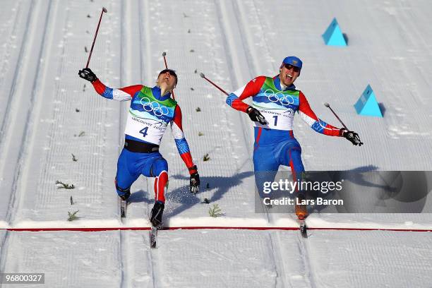 Nikita Kriukov and Alexander Panzhinskiy of Russia celebrate as they cross the finish line to finish first and second in the Men's Individual Sprint...