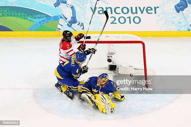 Meghan Agosta of Canada scores the opening goal during the ice hockey women's preliminary game between Canada and Sweden on day 6 of the 2010 Winter...