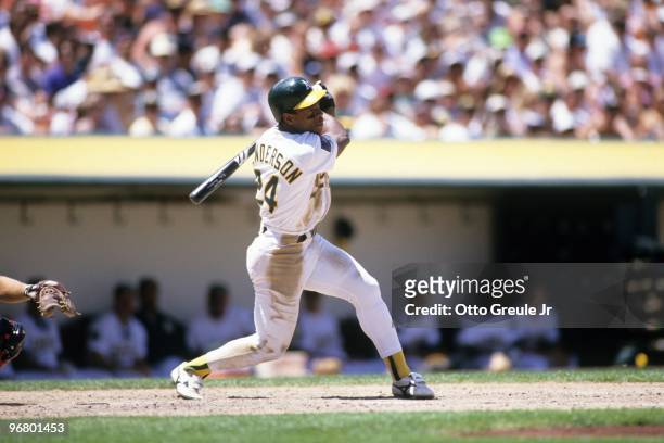 Rickey Henderson of the Oakland Athletics bats during their MLB game against the California Angels on June 26, 1994 at Oakland-Alameda County...