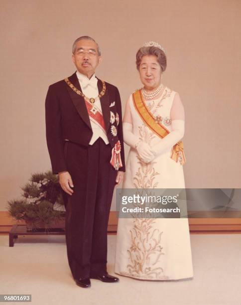 Portrait of Emperor Hirohito and wife Empress Kojun in formal attire, circa 1950s. .