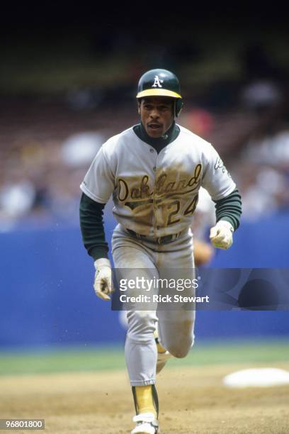 Rickey Henderson of the Oakland Athletics runs to third base during their MLB game against the Cleveland Indians circa May 1991 at Cleveland...