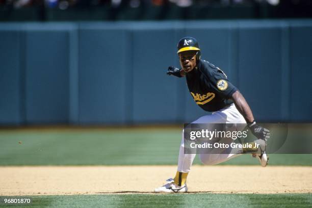 Rickey Henderson of the Oakland Athletics stops after rounding a base during their MLB game against the Minnesota Twins on April 17, 1994 at...