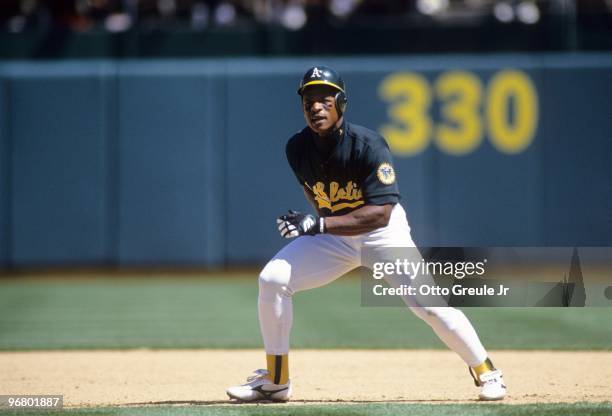 Rickey Henderson of the Oakland Athletics leads off from first base during their MLB game against the Minnesota Twins on April 17, 1994 at...