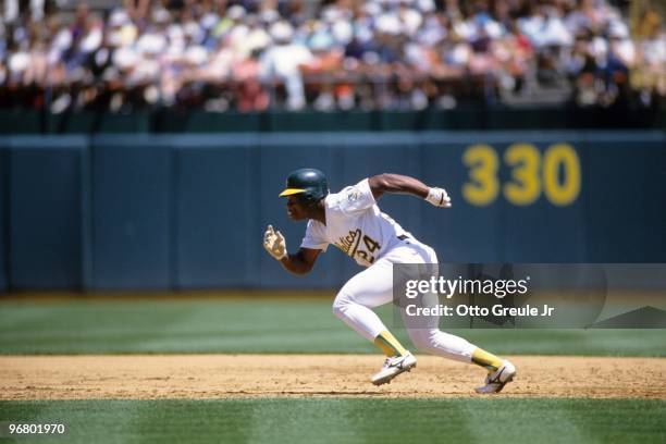 Rickey Henderson of the Oakland Athletics runs to second base during their MLB game against the Kansas City Royals at Oakland-Alameda County Coliseum...