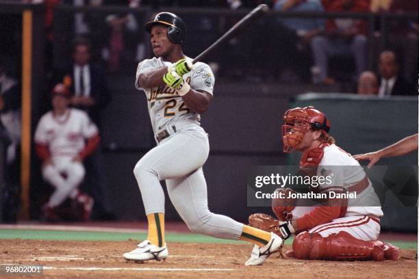 Rickey Henderson of the Oakland Athletics bats during Game One of the 1990 World Series against the Cincinnati Reds at Riverfront Stadium on October...