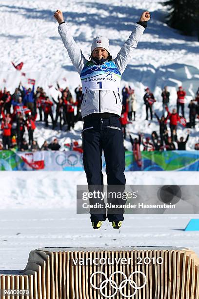 Marit Bjoergen of Norway celebrates on the podium after winning the gold medal during the flower ceremony for the Women's Individual Sprint C Final...