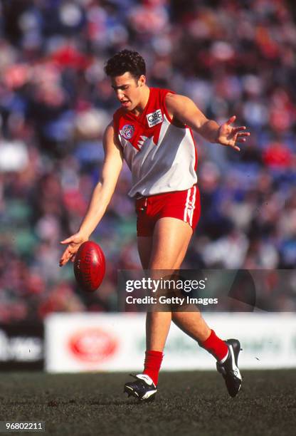 Anthony Rocca of the Swans kicks during the round 15 AFL match between the Sydney Swans and St Kilda in Melbourne, Australia.