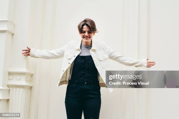 Young Woman With Short Hair Laughing And Hanging Out In The City