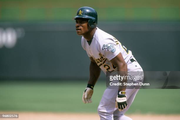 Rickey Henderson of the Oakland Athletics leads off during the game against the Texas Rangers at The Ballpark in Arlington on June 18, 1998 in...
