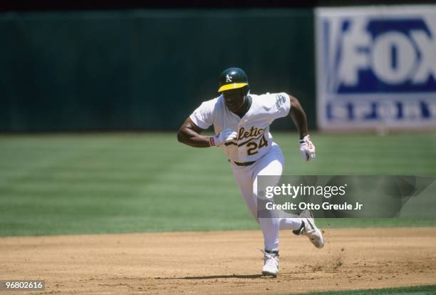 Rickey Henderson of the Oakland Athletics runs the bases during the game against the Seattle Mariners at Network Associates Coliseum on June 13, 1998...