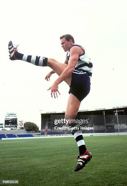 Ben Graham of the Cats kicks during an AFL feature at Kardinia Park on February 7, 2000 in Melbourne, Australia.