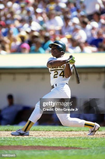 Rickey Henderson of the Oakland Athletics bats during an MLB game at Oakland-Alameda Coliseum circa 1990 in Oakland, California.