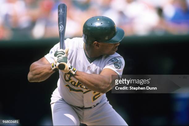 Rickey Henderson of the Oakland Athletics bats during the game against the Texas Rangers at The Ballpark in Arlington on June 18, 1998 in Arlington,...