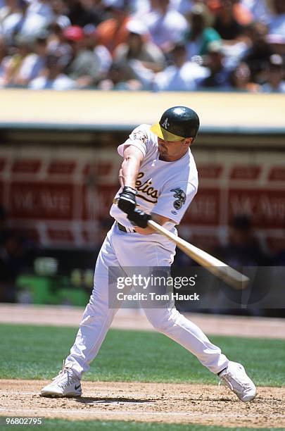 Jeremy Giambi of the Oakland Athletics bats during the game against the Texas Rangers at Network Associates Coliseum on June 24, 2001 in Oakland,...