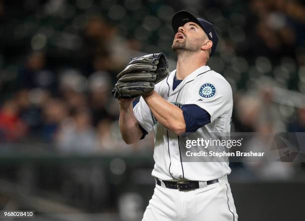 Relief pitcher Marc Rzepczynski of the Seattle Mariners reacts as he walks off the field during a game against the Texas Rangers at Safeco Field on...