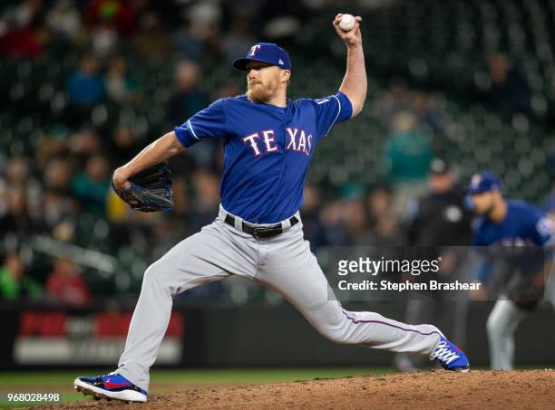 Reliever Jake Diekman of the Texas Rangers delivers a pitch during a game against the Seattle Mariners at Safeco Field on May 29, 2018 in Seattle,...