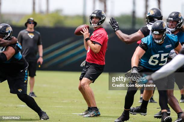 Jacksonville Jaguars quarterback Blake Bortles looks for a receiver during the Jaguars OTA on June 5, 2018 at Dream Finders Homes Practice Complex in...