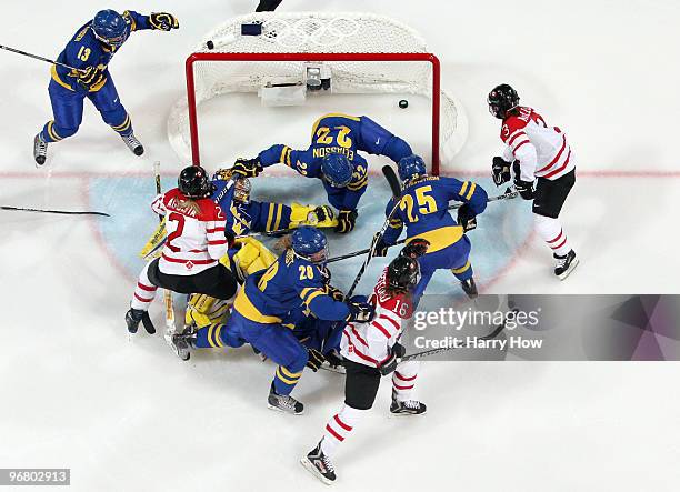 Meghan Agosta of Canada scores a goal during the ice hockey women's preliminary game between Canada and Sweden on day 6 of the 2010 Winter Olympics...