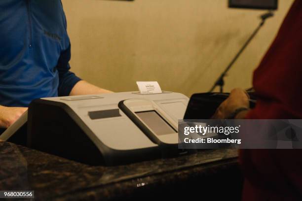 Guest places a bet during the launch of full-scale sports betting at Dover Downs Hotel and Casino in Dover, Delaware, U.S., on Tuesday, June 5, 2018....