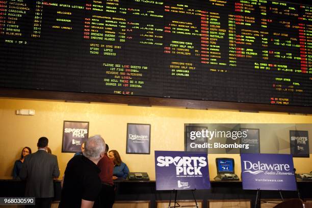 Guest looks at a gaming board during the launch of full-scale sports betting in Dover, Delaware, U.S., on Tuesday, June 5, 2018. Delaware became the...