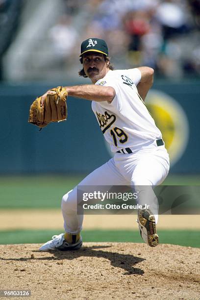 Gene Nelson of the Oakland Athletics pitches during a game against the Cleveland Indians at Oakland-Alameda County Coliseum in May of 1992 in...