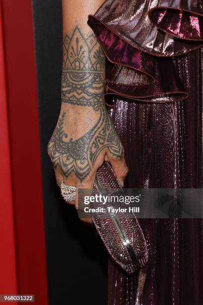 Rihanna, clutch and tattoo detail, attends the world premiere of "Ocean's 8" at Alice Tully Hall at Lincoln Center on June 5, 2018 in New York City.