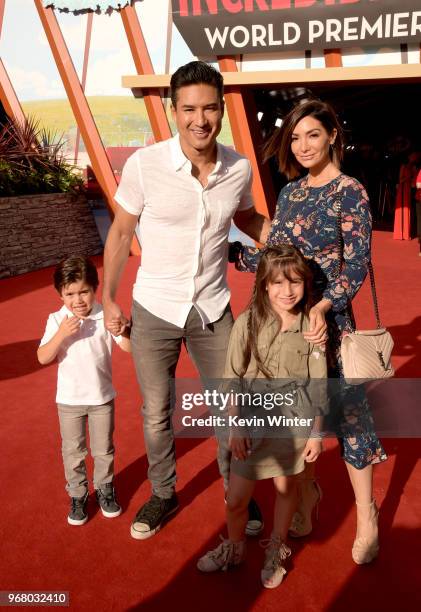 Dominic Lopez, Mario Lopez, Gia Francesca Lopez, and Courtney Laine Mazza attend the premiere of Disney and Pixar's "Incredibles 2" at the El Capitan...