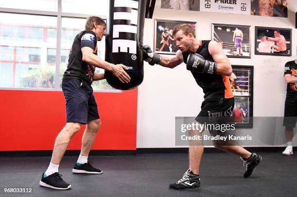 Jeff Horn hits the bag with Trainer Glenn Rushton during a training session on June 5, 2018 in Las Vegas, Nevada.