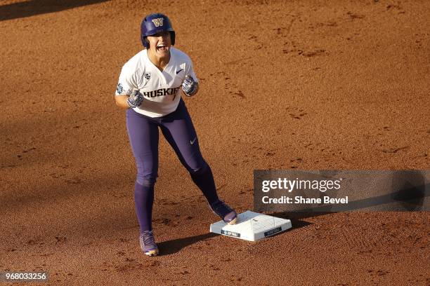 Taylor Van Zee of the Washington celebrates a run against the Florida State Seminoles races to third base against the Washington Huskies during the...