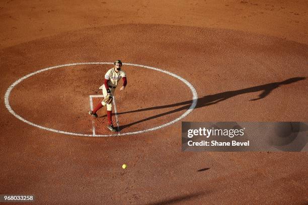 Meghan King of the Florida State Seminoles pitches against the Washington Huskies during the Division I Women's Softball Championship held at USA...
