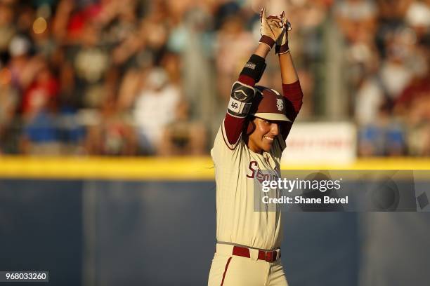 Zoe Casas of the Florida State Seminoles celebrates after hitting a double against the Washington Huskies during the Division I Women's Softball...