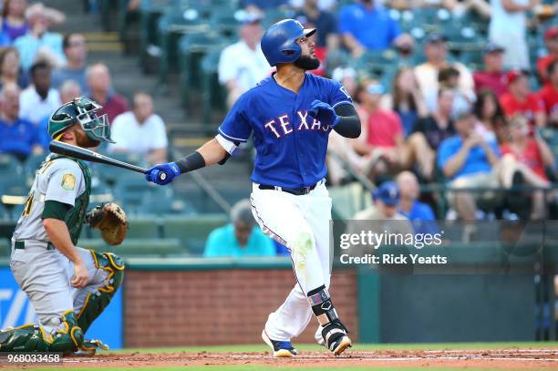 Nomar Mazara of the Texas Rangers hits in the first inning against the Oakland Athletics at Globe Life Park in Arlington on June 5, 2018 in...