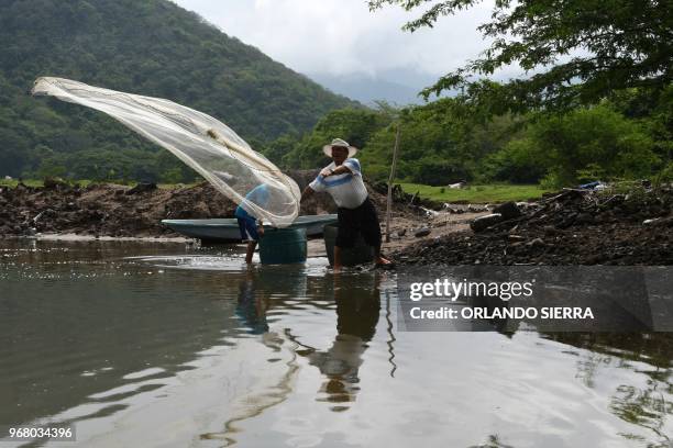 Lorenzo Aguilera and his son fish for shrimp on Exposicion Island off the Pacific coast of Honduras in the Gulf of Fonseca, 100 km south of...