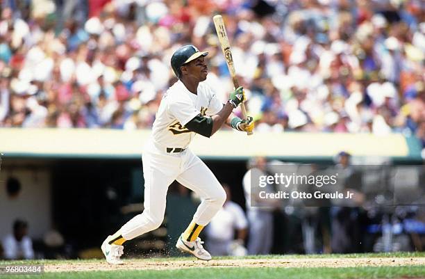 Willie Randolph of the Oakland Athletics makes a hit during a 1990 season game at Oakland-Alameda County Coliseum in Oakland, California.