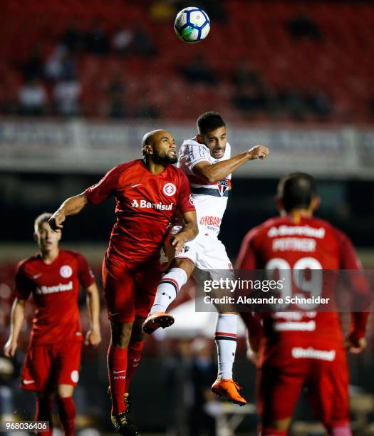 Pablo Escobar of Sao Paulo and China of Internacional in action during the match between Sao Paulo and Internacional for the Brasileirao Series A...