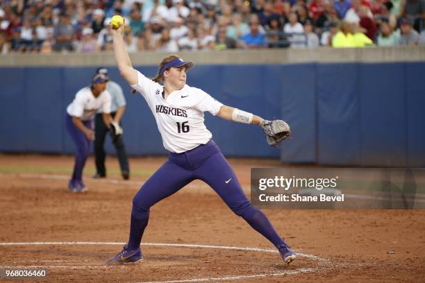 Gabbie Plain of the Washington Huskies pitches against the Florida State Seminoles during the Division I Women's Softball Championship held at USA...