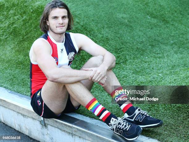 Hunter Clark shows off his Pride Game socks during a We Are Pride Cup Launch press conference at AFL House on June 6, 2018 in Melbourne, Australia.