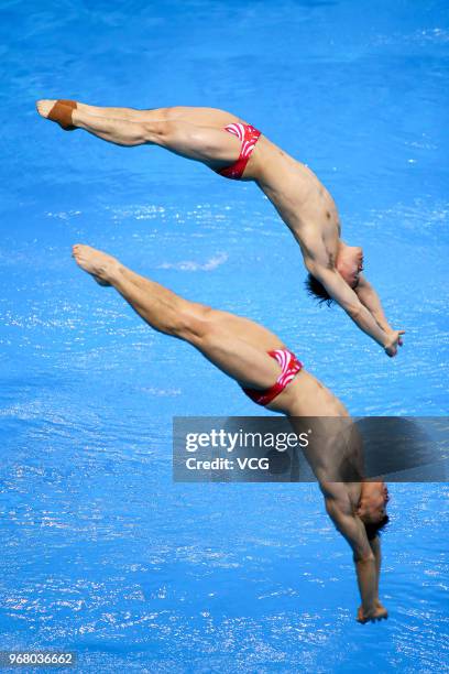 Cao Yuan of China and Xie Siyi of China compete in the Men's 3m Synchro Springboard final on day one of the 21st FINA Diving World Cup 2018 at...