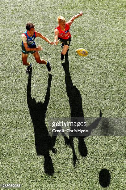 Will Powell and Connor Nutting compete for the ball during a Gold Coast Suns AFL training session at Metricon Stadium on June 6, 2018 in Gold Coast,...