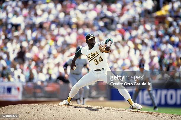 Dave Stewart of the Oakland Athletics pitches during an MLB game against the New York Yankees circa 1990 at Oakland-Alameda County Coliseum in...