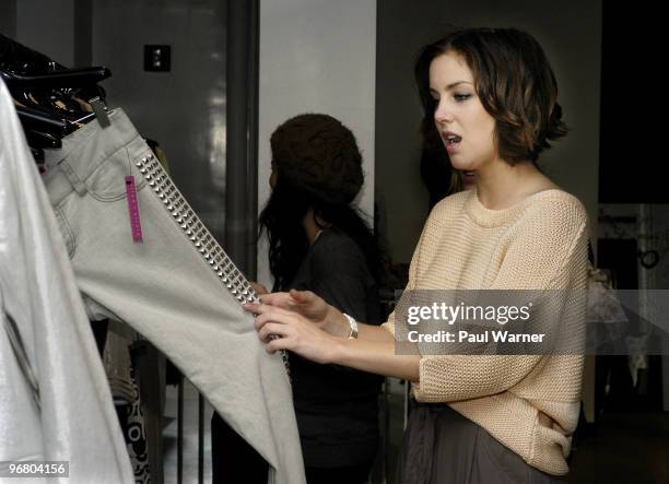 Actress Jessica Stroup of the show "90210" shops at Alice + Olivia Boutique by Stacey Bendet on February 17, 2010 in New York City.