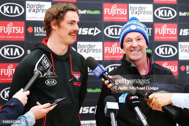 Legend Neale Daniher and Joe Daniher of the Bombers speak to media during an Essendon Bombers AFL media opportunity at The Hangar on June 6, 2018 in...