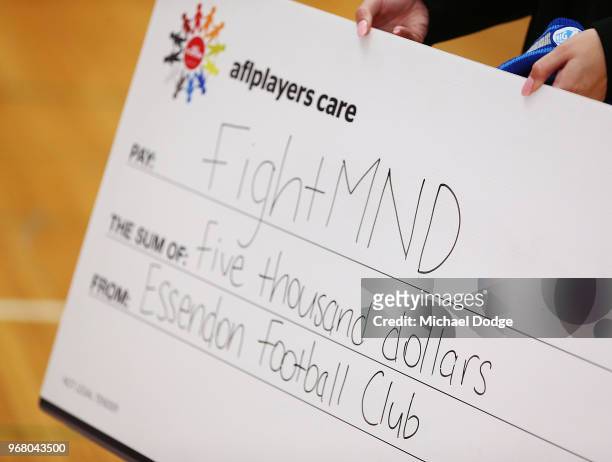 Cheque is seen during an Essendon Bombers AFL media opportunity at The Hangar on June 6, 2018 in Melbourne, Australia. Joe presented Neale Daniher...