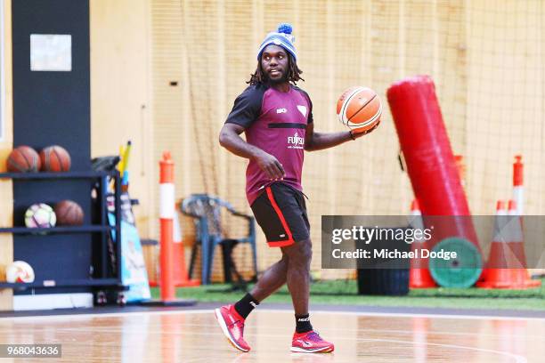 Anthony McDonald-Tipungwuti of the Bombers wears a Fight MND beanie before an Essendon Bombers AFL media opportunity at The Hangar on June 6, 2018 in...