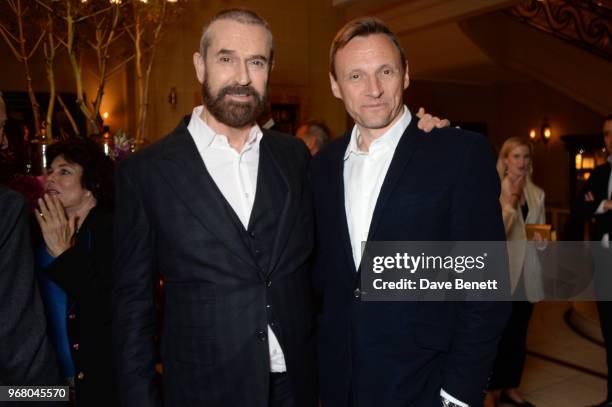 Rupert Everett and Zygi Kamasa attend an after party following the UK Premiere of "The Happy Prince" hosted by Justine Picardie, editor of Harper's...