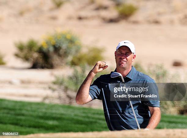 Stewart Cink celebrates holing his bunker shot on the 16th hole during round one of the Accenture Match Play Championship at the Ritz-Carlton Golf...