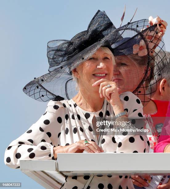 Dame Helen Mirren watches the racing as she attends Derby Day of the Investec Derby Festival at Epsom Racecourse on June 2, 2018 in Epsom, England.