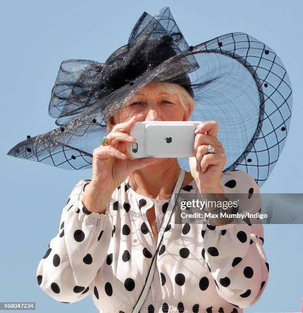 Dame Helen Mirren watches the racing as she attends Derby Day of the Investec Derby Festival at Epsom Racecourse on June 2, 2018 in Epsom, England.