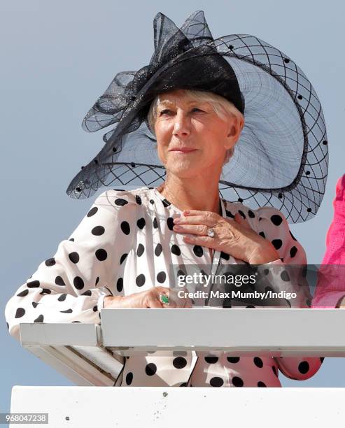 Dame Helen Mirren watches the racing as she attends Derby Day of the Investec Derby Festival at Epsom Racecourse on June 2, 2018 in Epsom, England.