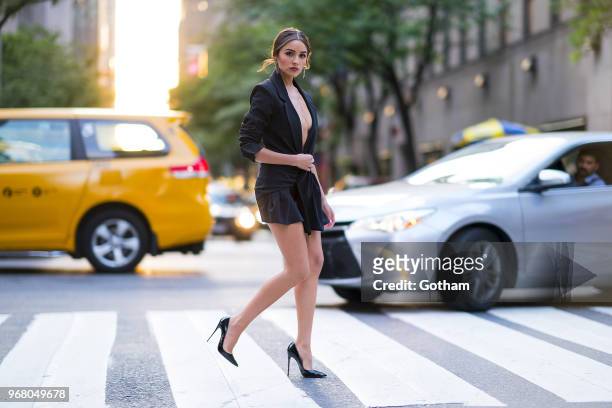 Olivia Culpo is seen wearing a Jacquemus top with Christian Louboutin shoes in Midtown on June 5, 2018 in New York City.